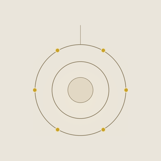 Orbit chandelier — two brass rings turning around a carved alabaster core